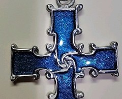 Reversible Silver Tone Celtic Cross on one side Blue color on other side.