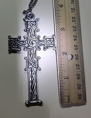 Reversible Silver Tone Celtic Cross on one side Blue color on other side.