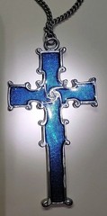 Reversible Silver Tone Celtic Cross on one side Blue color on other side.